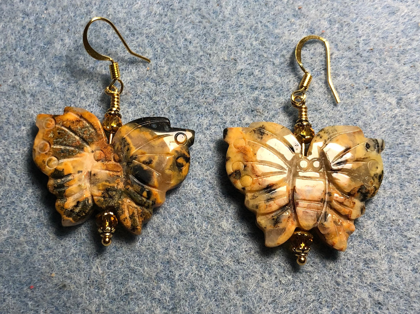 Large rainforest jasper gemstone butterfly bead earrings adorned with topaz Chinese crystal beads.