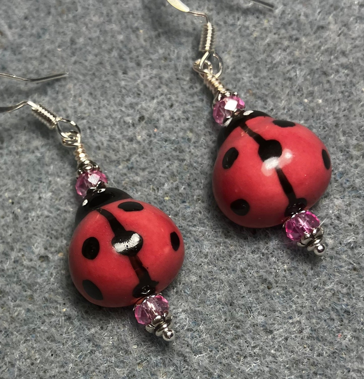 Rose pink and black ceramic ladybug bead earrings adorned with rose pink Chinese crystal beads.