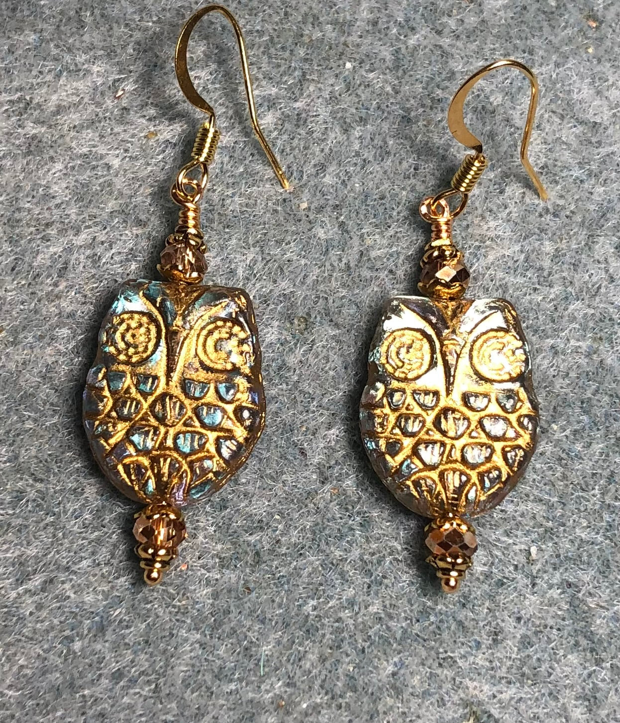 Clear (with gold wash) Czech glass owl bead earrings adorned with gold Chinese crystal beads.