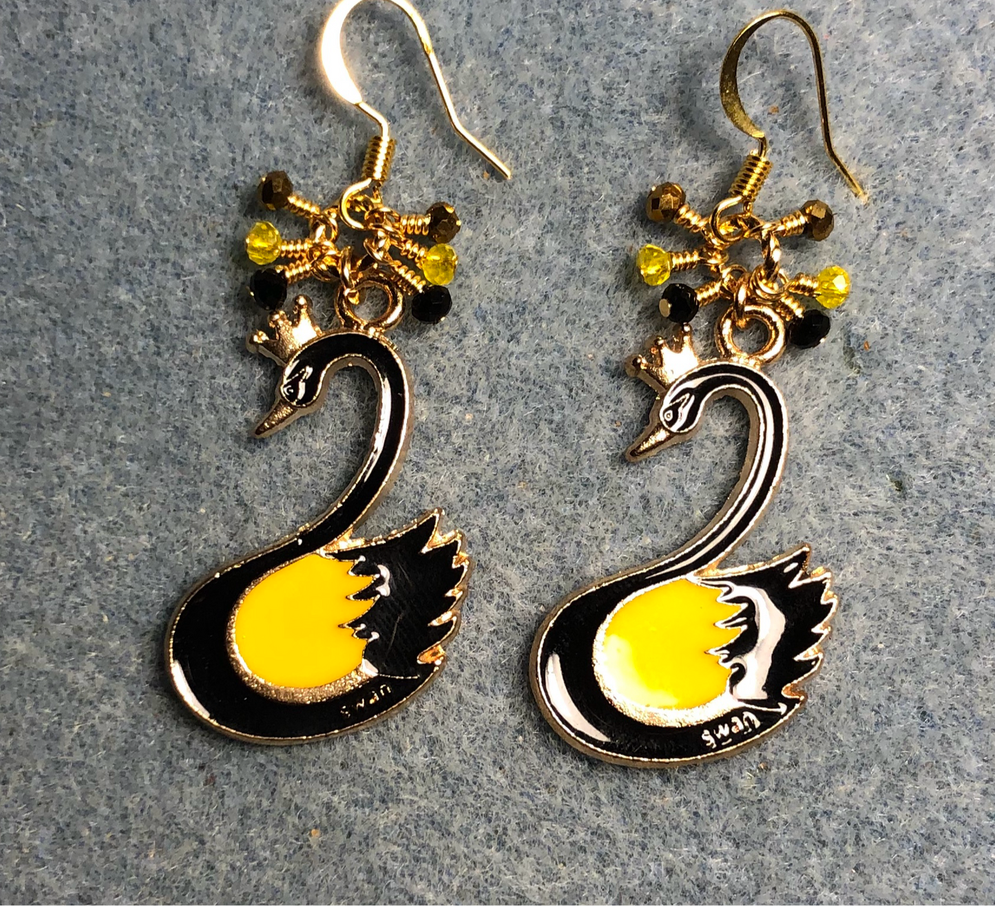 Yellow and black enamel swan charm earrings adorned with tiny dangling yellow and black Chinese crystal beads.