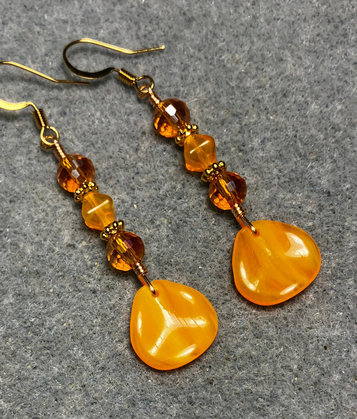 Tangerine Czech glass rose petal earrings adorned with tangerine and orange Czech glass beads.
