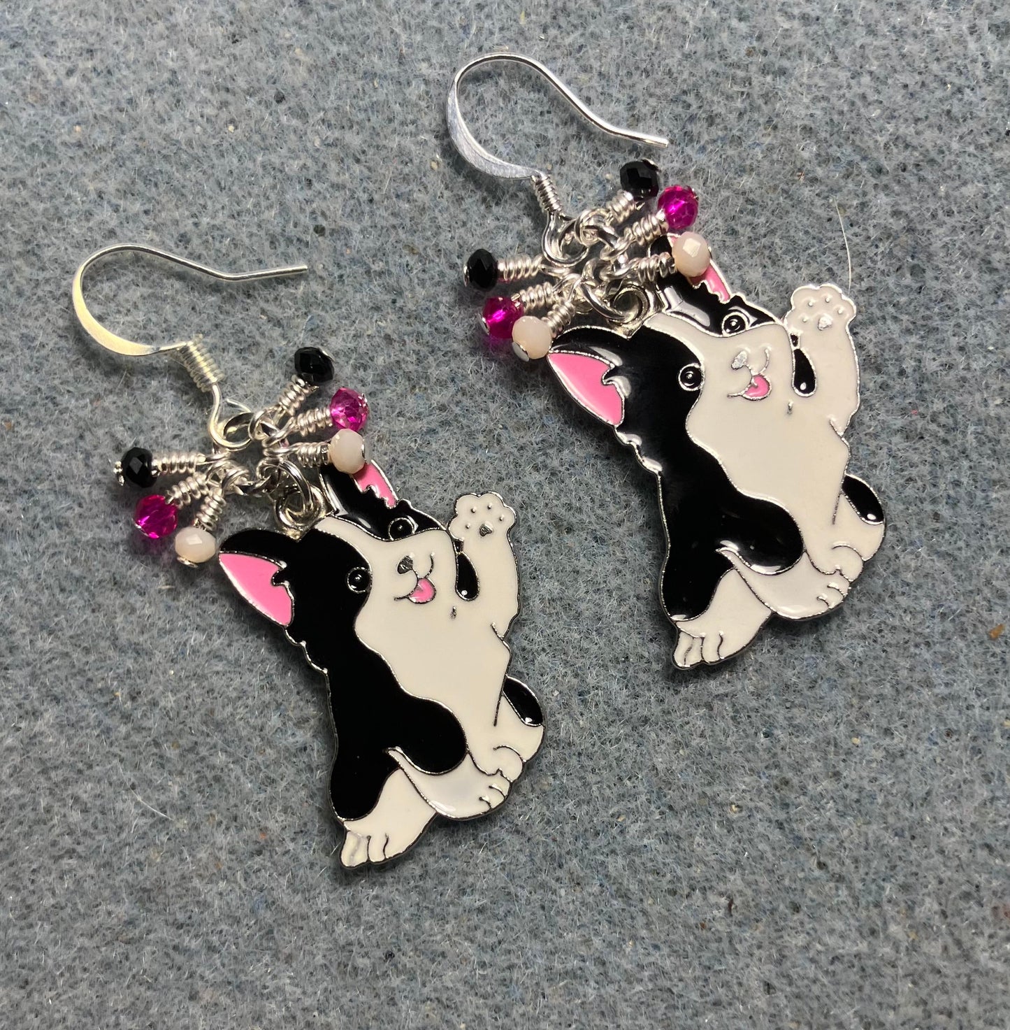 Large black, white, and hot pink enamel puppy dog charm earrings adorned with tiny dangling black, white, and hot pink Chinese crystal beads.