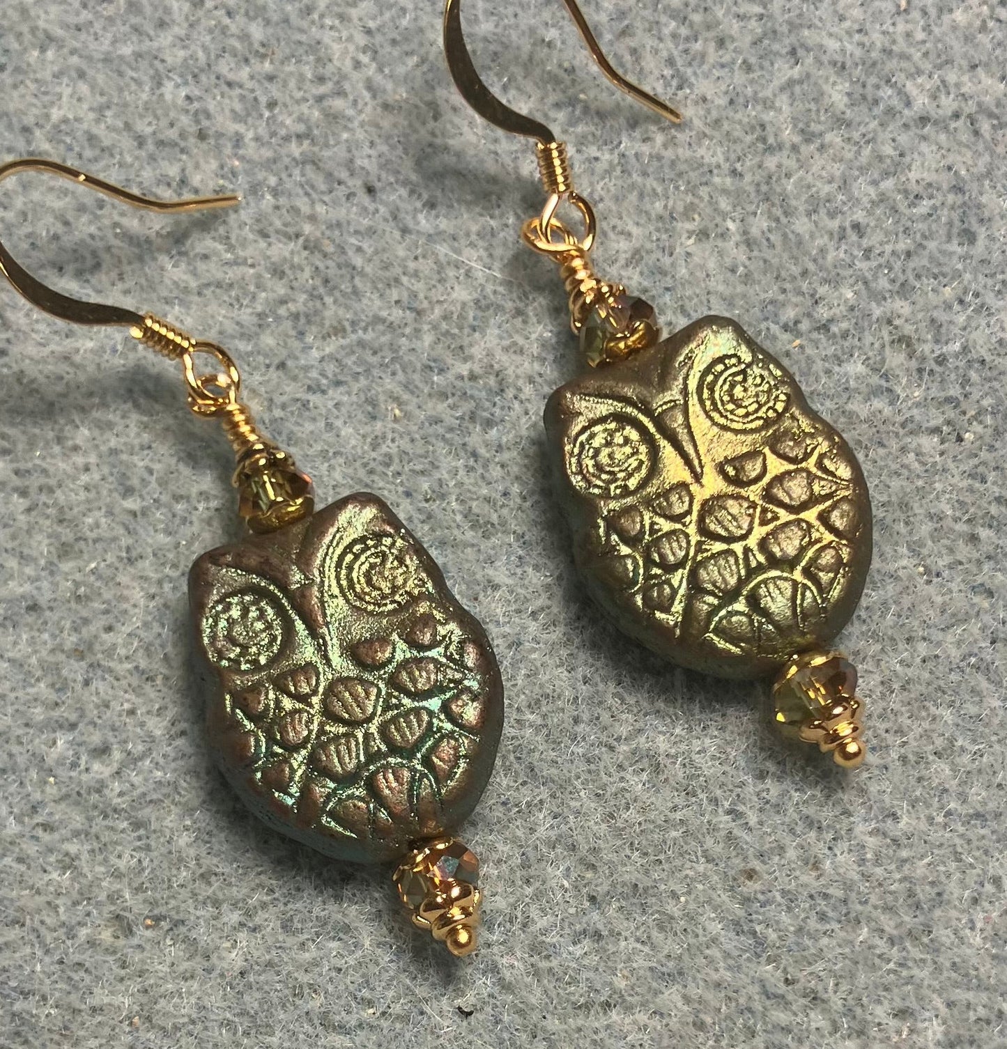 Sparkly green Czech glass owl bead earrings adorned with sparkly green Chinese crystal beads.