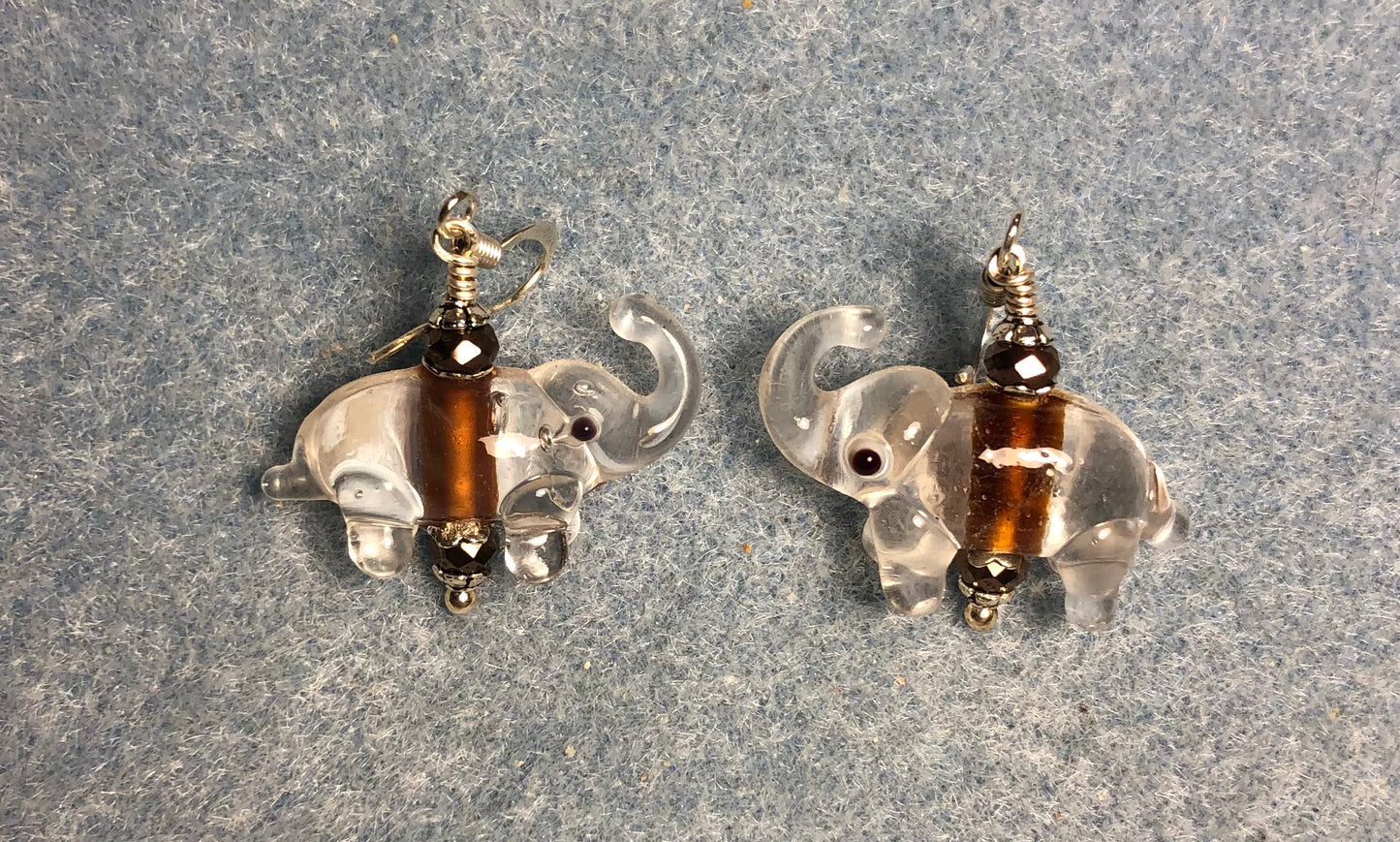 Clear and brown lamp work elephant bead earrings adorned with brown Chinese crystal beads.