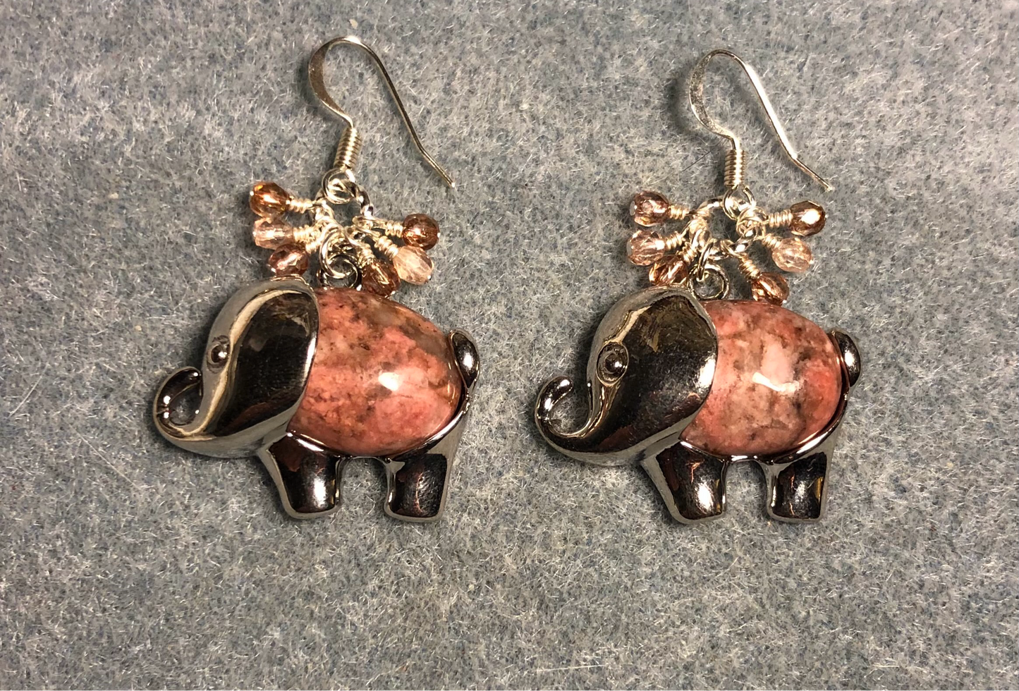 Large silver and pink rhodonite gemstone elephant charm earrings adorned with small dangling pink and peach Czech glass beads.