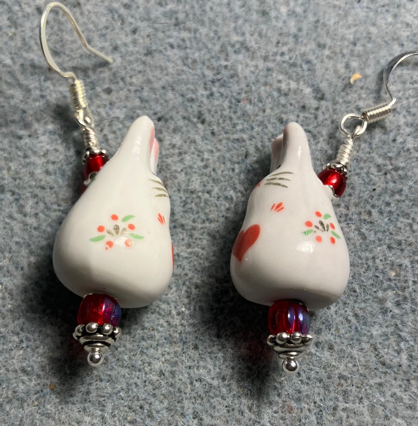 White and red ceramic bunny rabbit bead earrings adorned with red Czech glass beads.