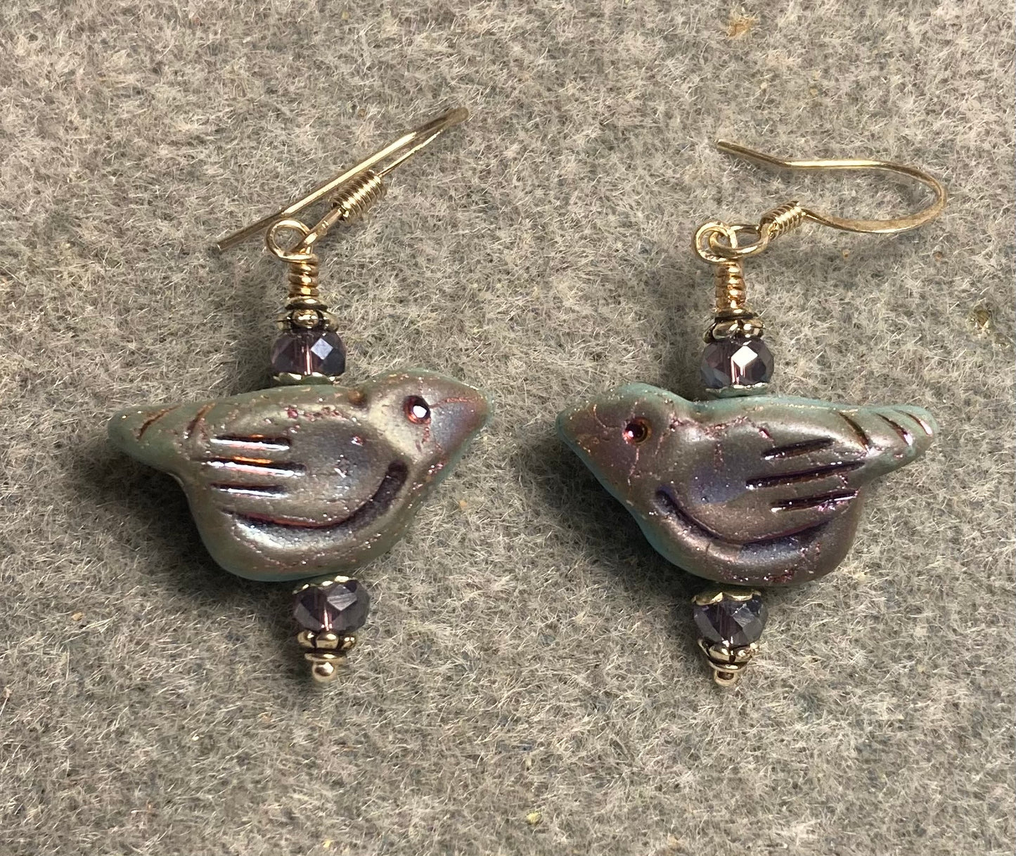 Light blue and purple metallic Czech glass bird bead earrings adorned with violet Chinese crystal beads.