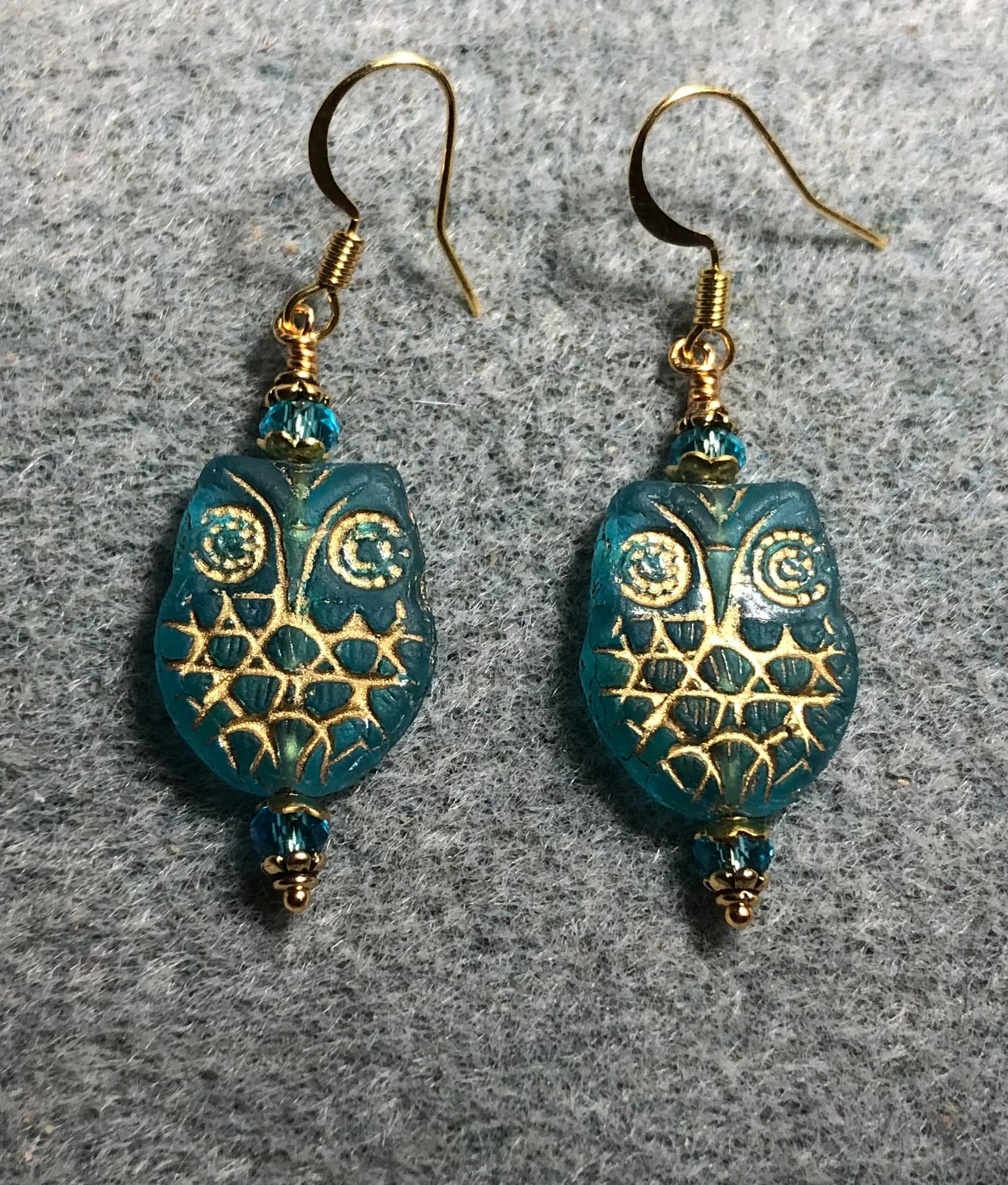 Turquoise (with gold wash) Czech glass owl bead earrings adorned with turquoise Chinese crystal beads.