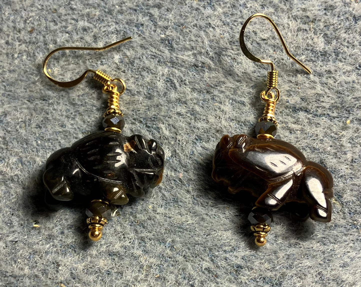 Brown tigereye gemstone buffalo bead earrings adorned with brown Chinese crystal beads.