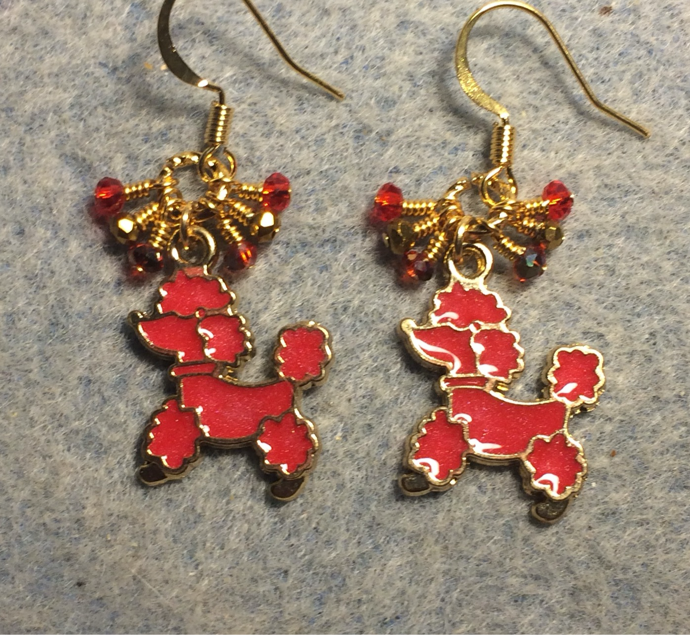 Red and gold enamel poodle charm earrings adorned with tiny dangling red and gold Chinese crystal beads.