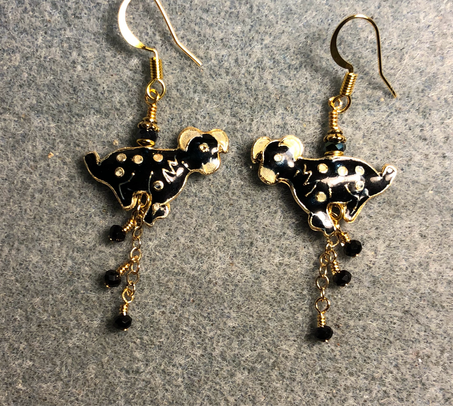 Black and white vintage cloisonné dog bead earrings adorned with gold chain and tiny black Chinese crystal beads.