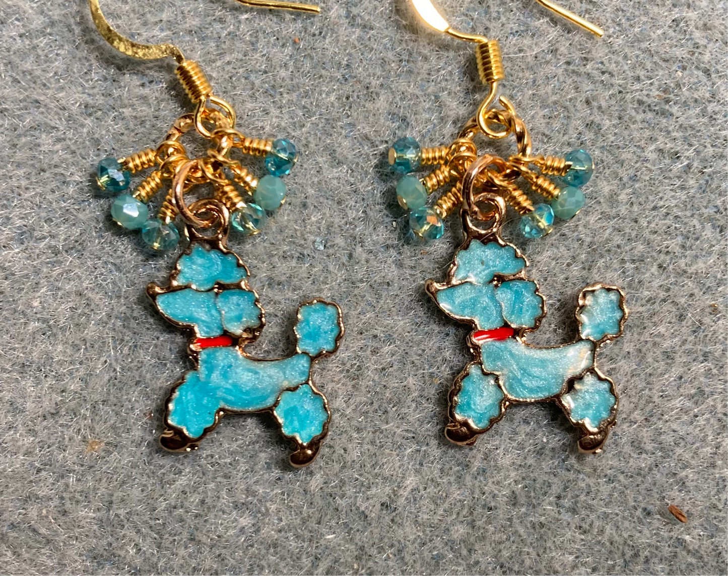 Turquoise and red enamel poodle charm earrings adorned with tiny dangling turquoise Chinese crystal beads.