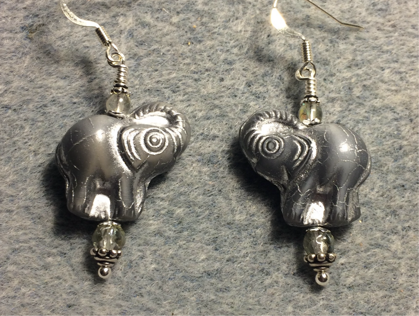 Gray (with silver inlay) Czech glass elephant bead earrings adorned with gray Czech glass beads.