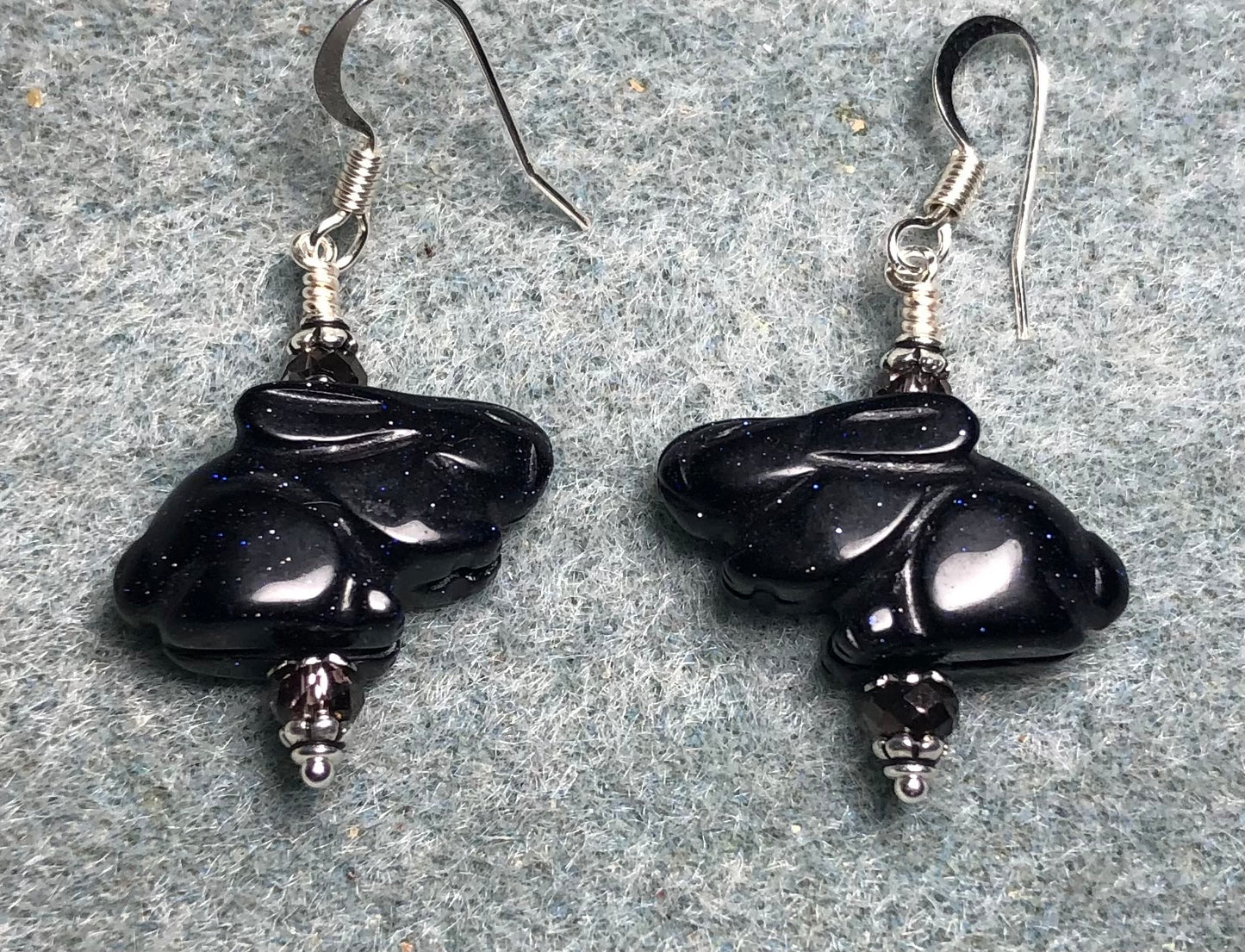 Blue goldstone gemstone rabbit bead earrings adorned with purple Chinese crystal beads.
