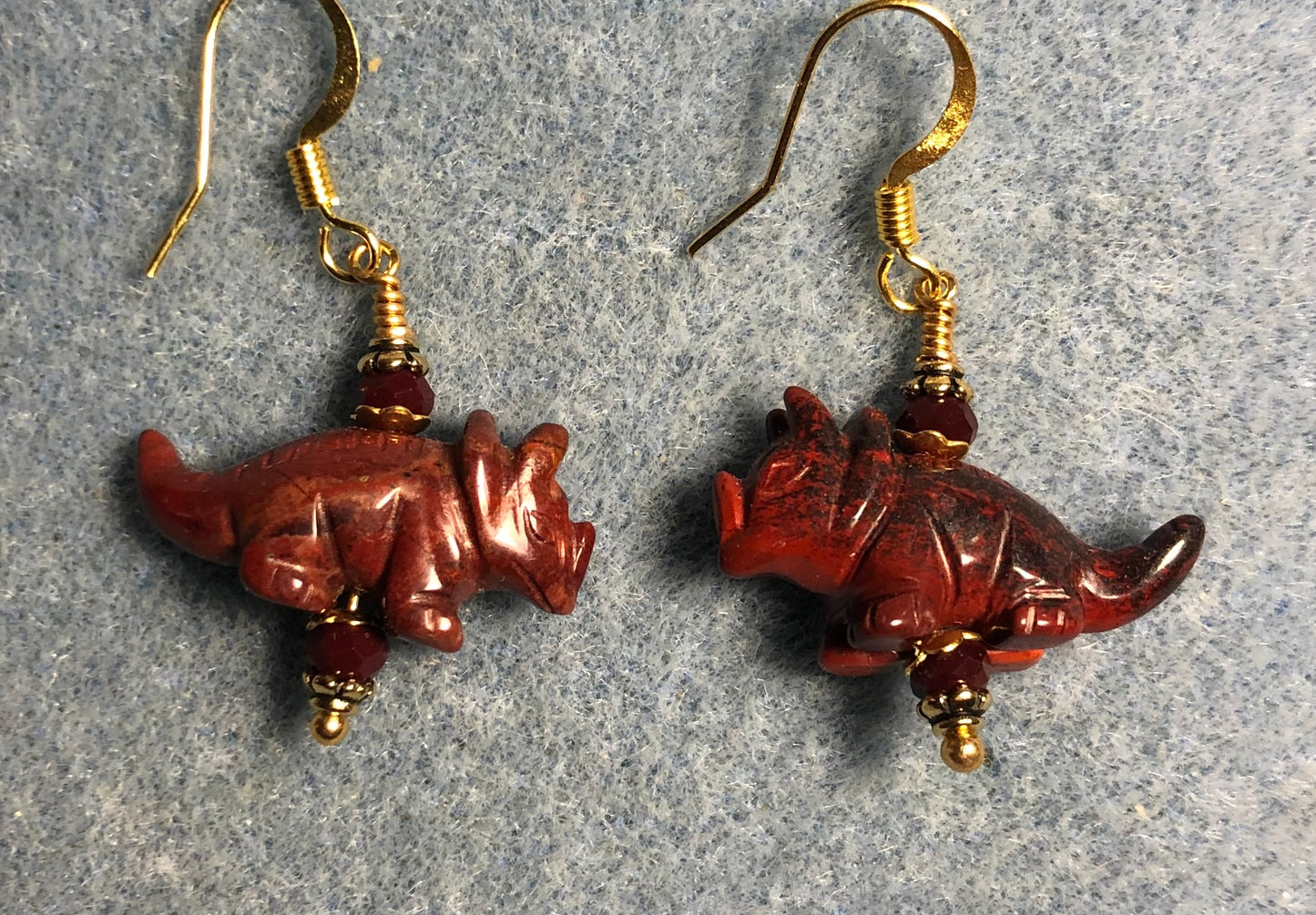 Poppy jasper gemstone dinosaur bead earrings adorned with dark red Chinese crystal beads.