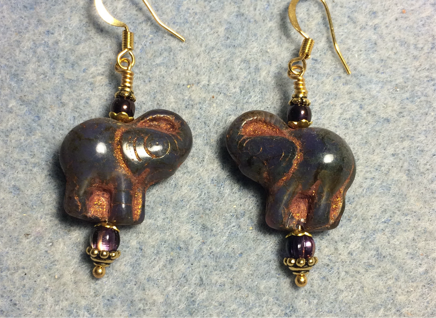Opaque dark purple (with copper inlay) Czech glass elephant bead earrings adorned with dark purple Czech glass beads.
