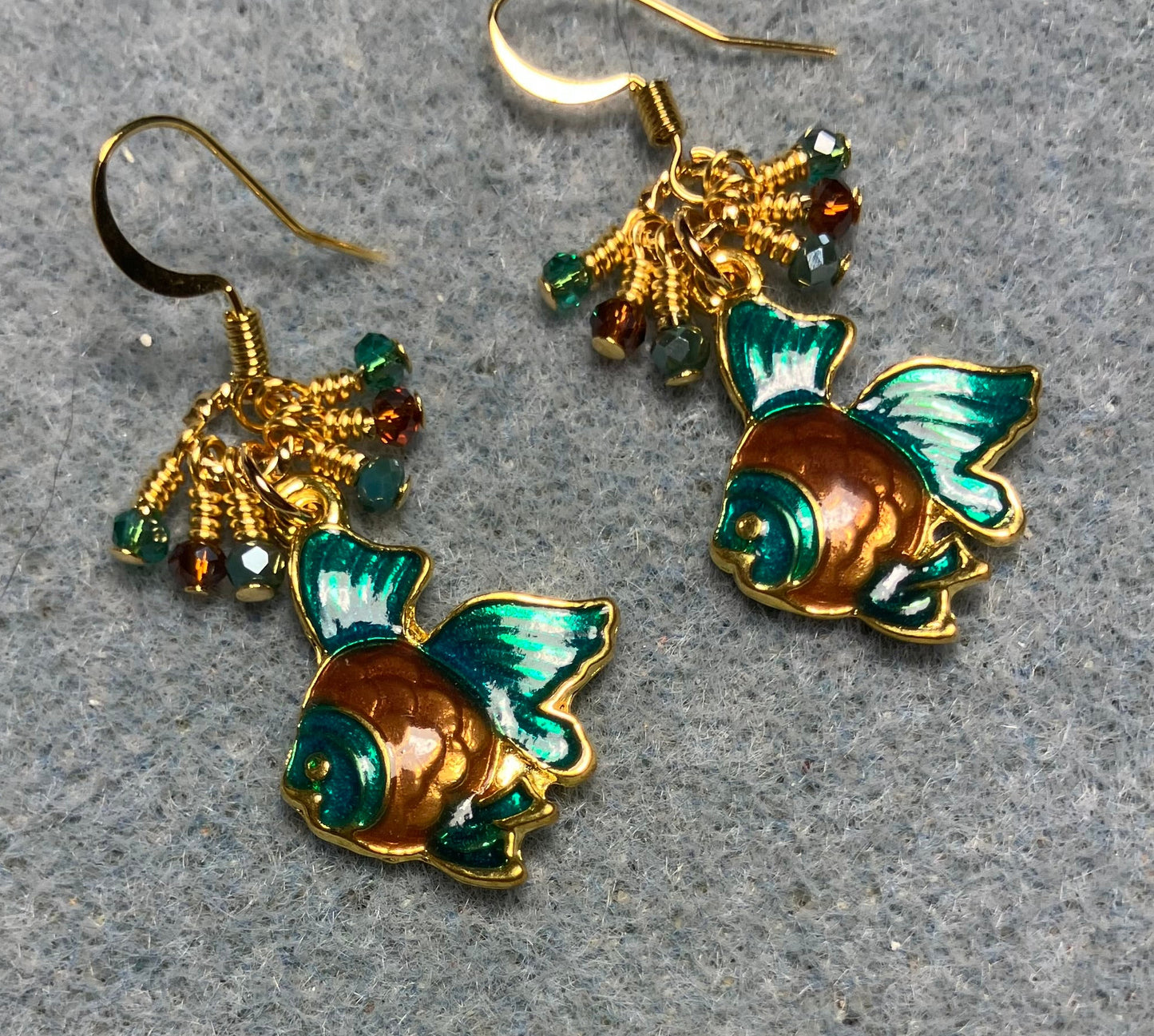 Teal and brown enamel angelfish charm earrings adorned with tiny dangling teal and brown Chinese crystal beads.