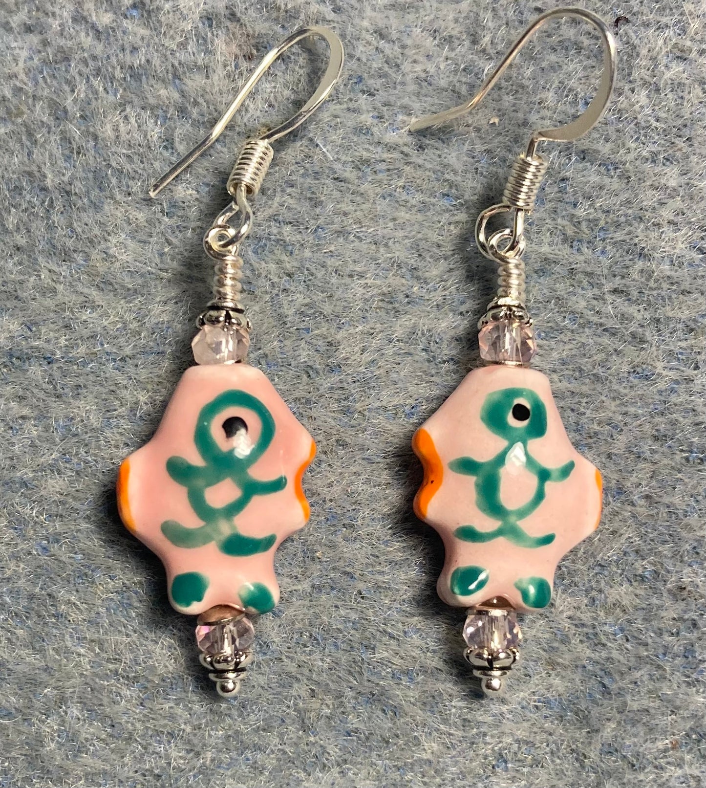 Small light pink and green ceramic fish bead earrings adorned with pink Chinese crystal beads.