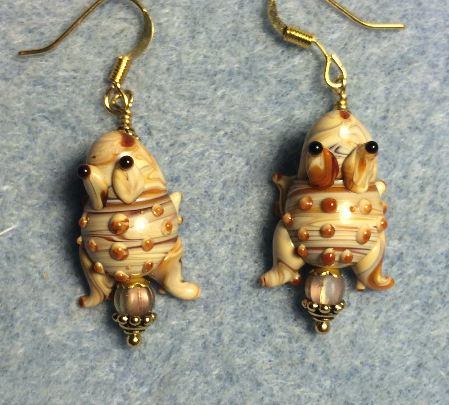 Tan lamp work bumpy toad bead earrings adorned with tan Czech glass beads.
