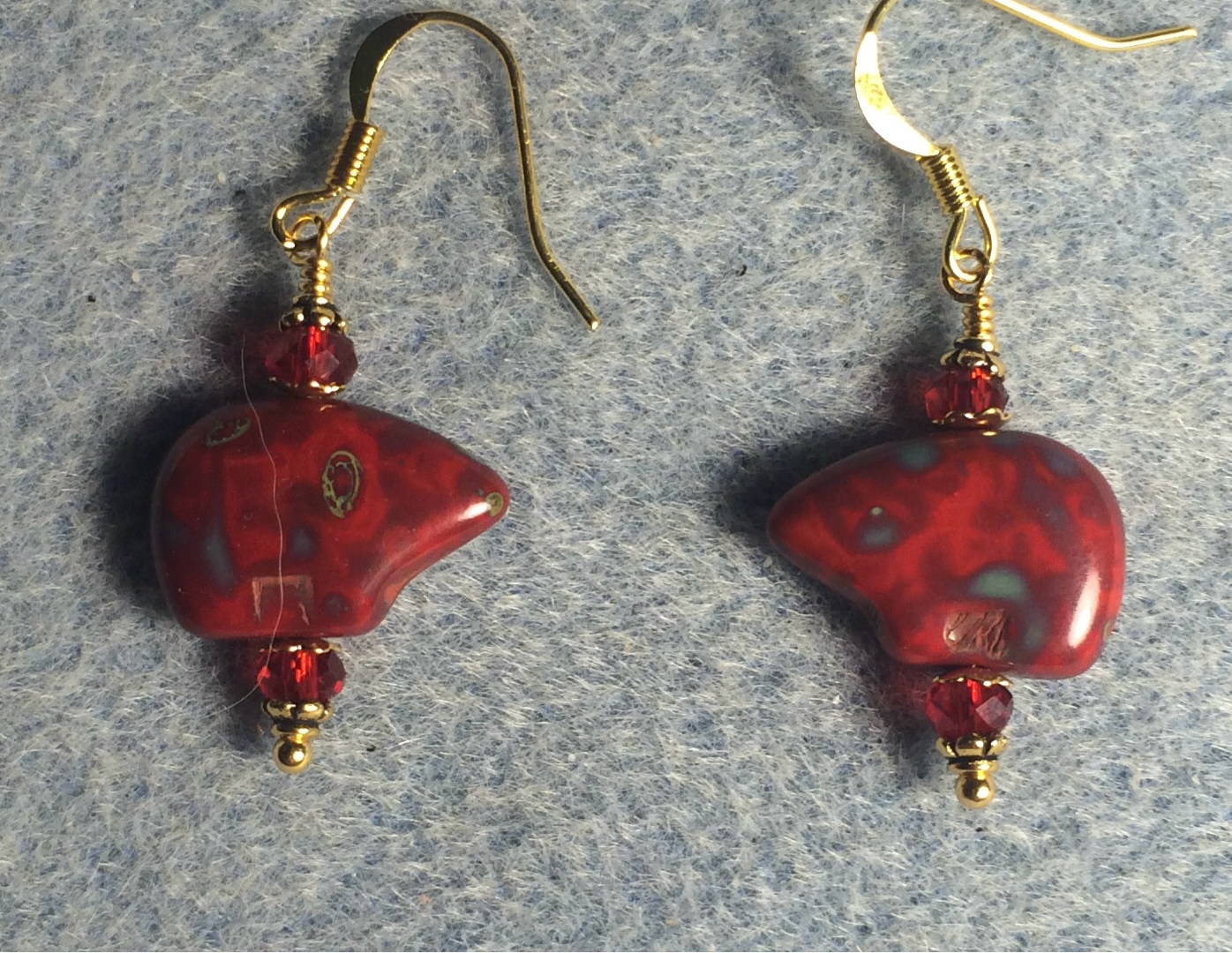 Red Picasso Czech glass bear bead earrings adorned with dark red Chinese crystal beads.