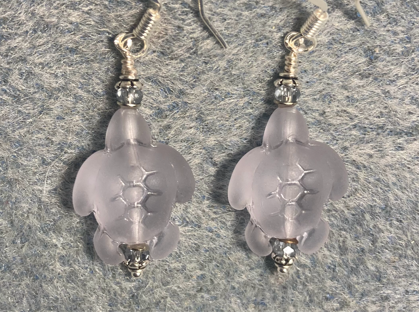 Light blue sea glass sea turtle bead earrings adorned with light blue Chinese crystal beads.