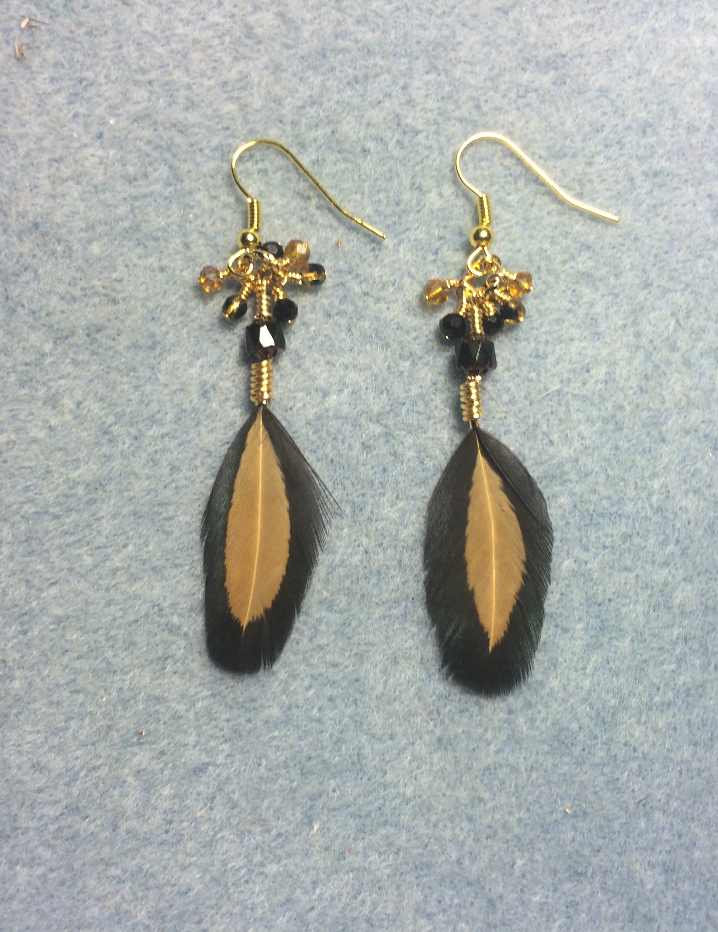 Black and brown pheasant feather earrings adorned with tiny dangling black and brown Czech glass beads.