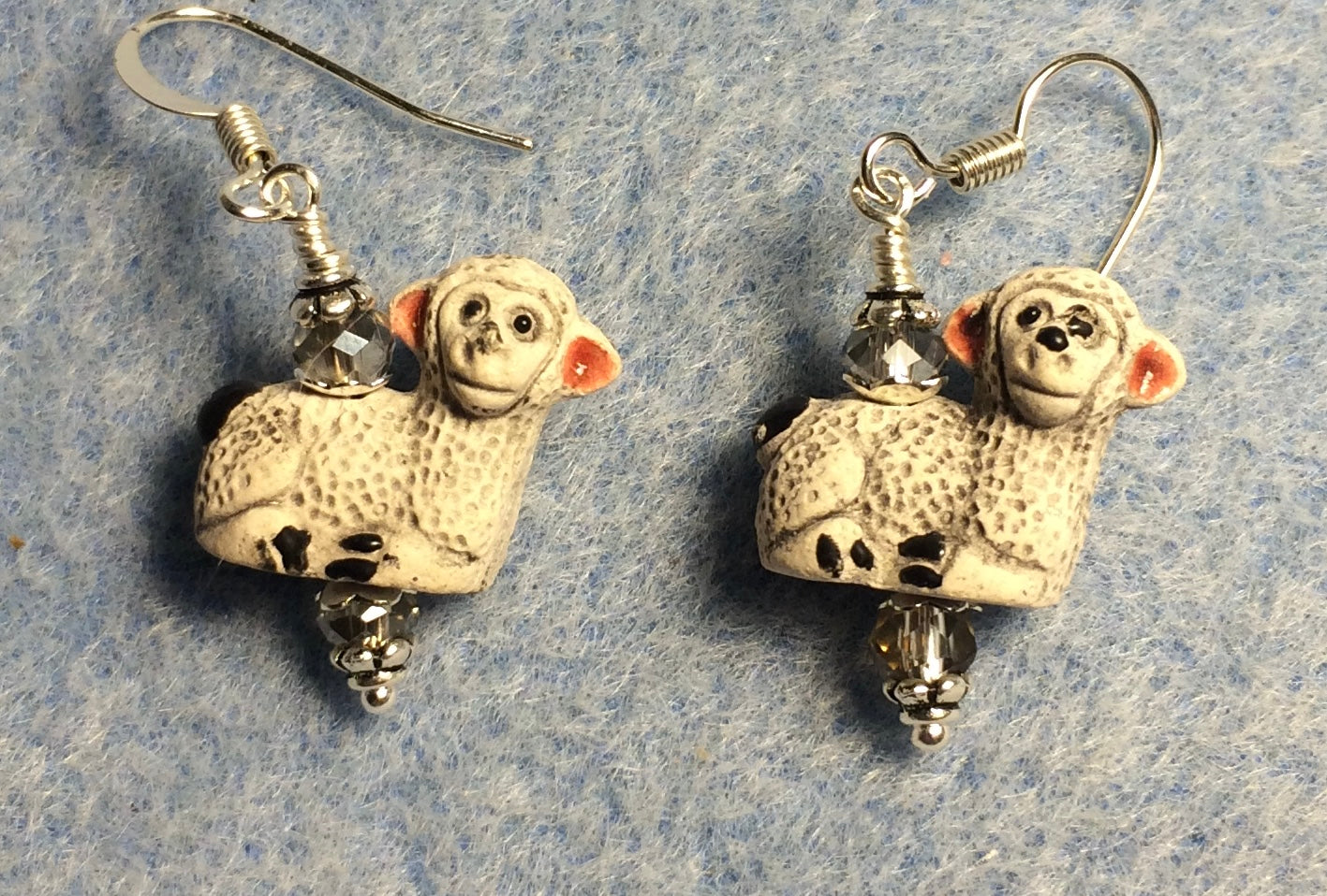Small gray and pink ceramic lamb bead earrings adorned with clear Chinese crystal beads.