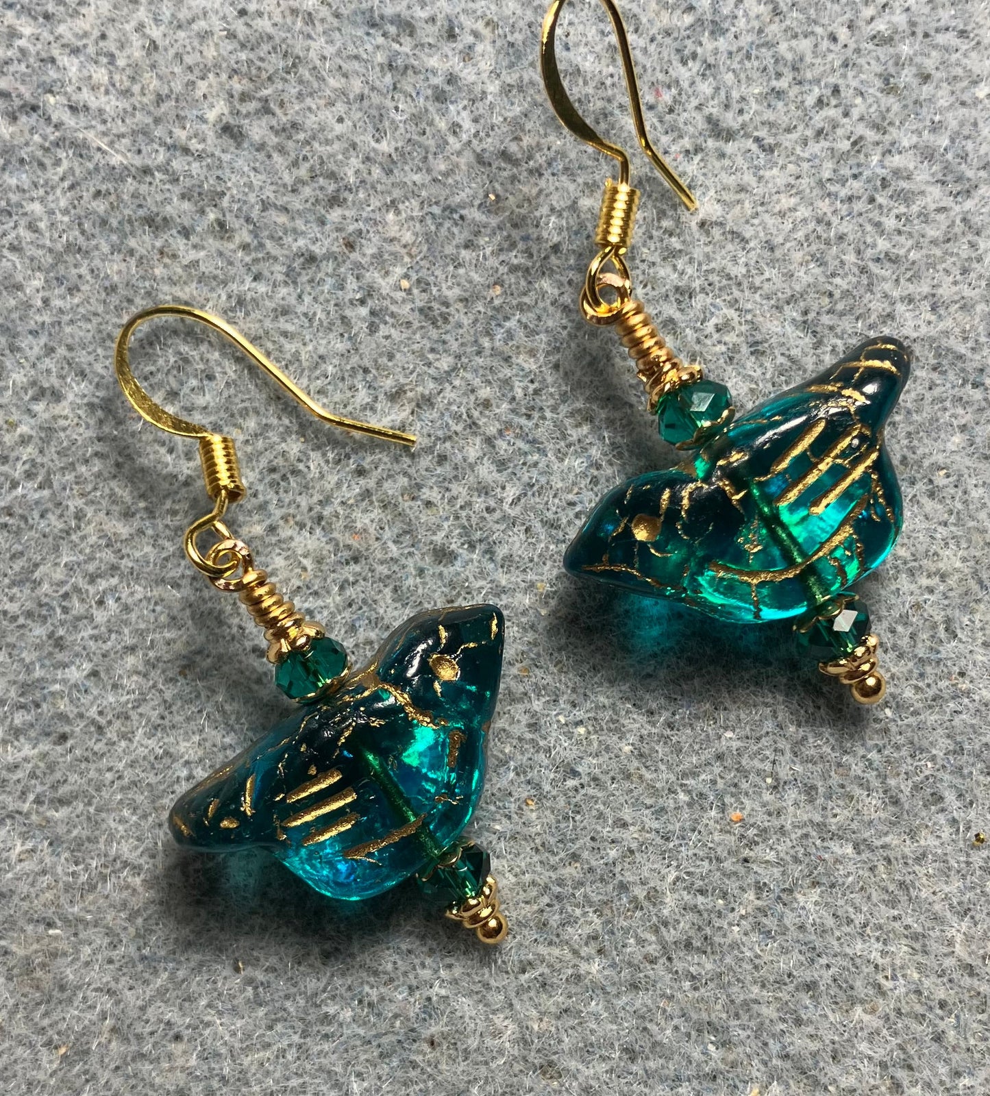 Teal (with gold wash) Czech glass bird bead earrings adorned with teal Chinese crystal beads.