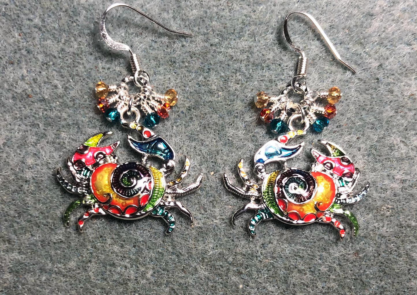 Silver and multicolored enamel crab charm earrings adorned with tiny dangling turquoise, red, and amber Chinese crystal beads.