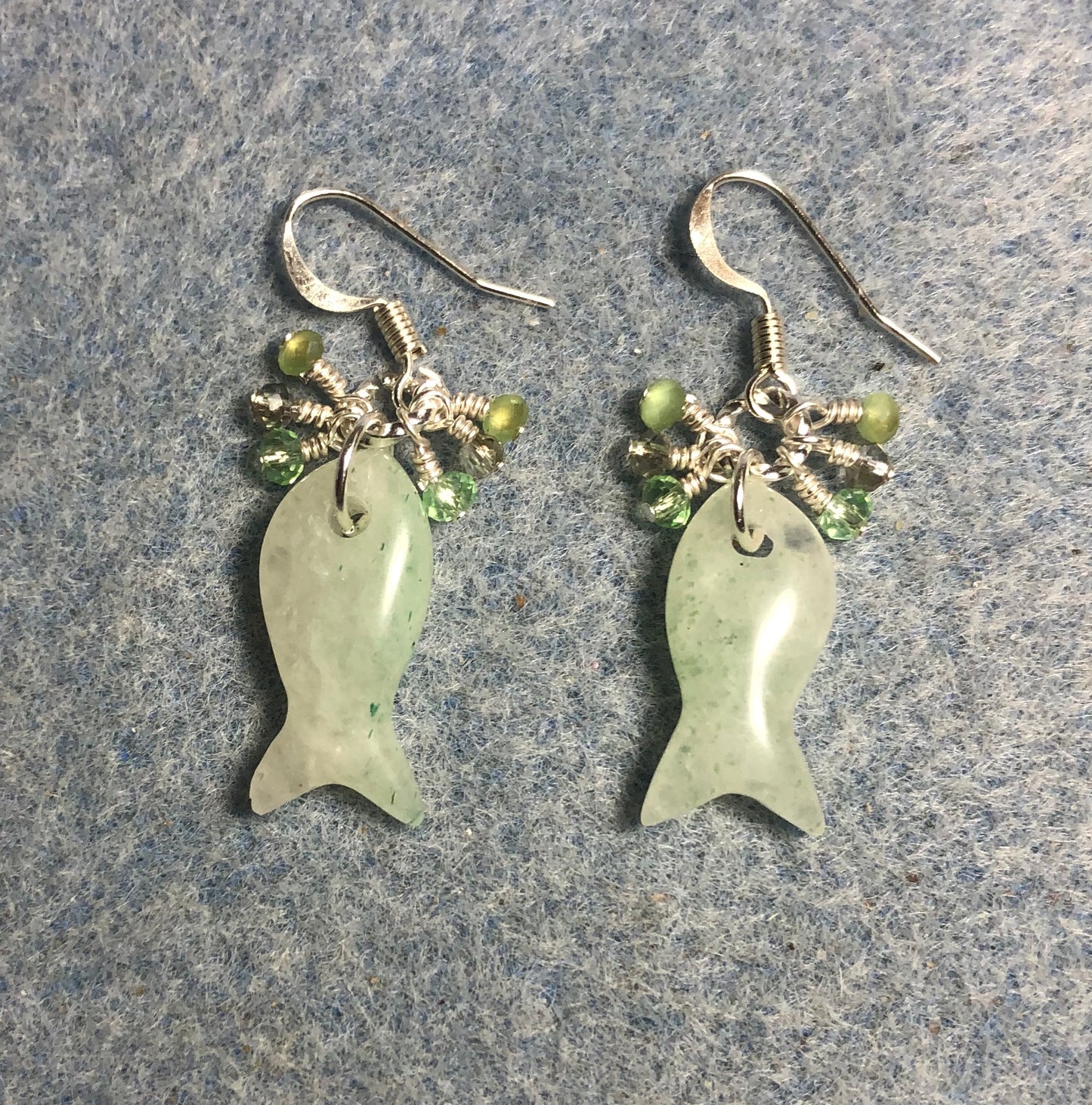 Light green aventurine gemstone fish bead earrings adorned with tiny dangling Chinese crystal beads.