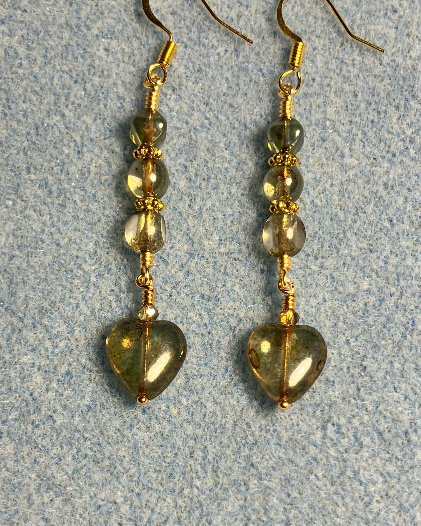 Small olive green Czech glass heart bead earrings adorned with olive green Czech glass beads.
