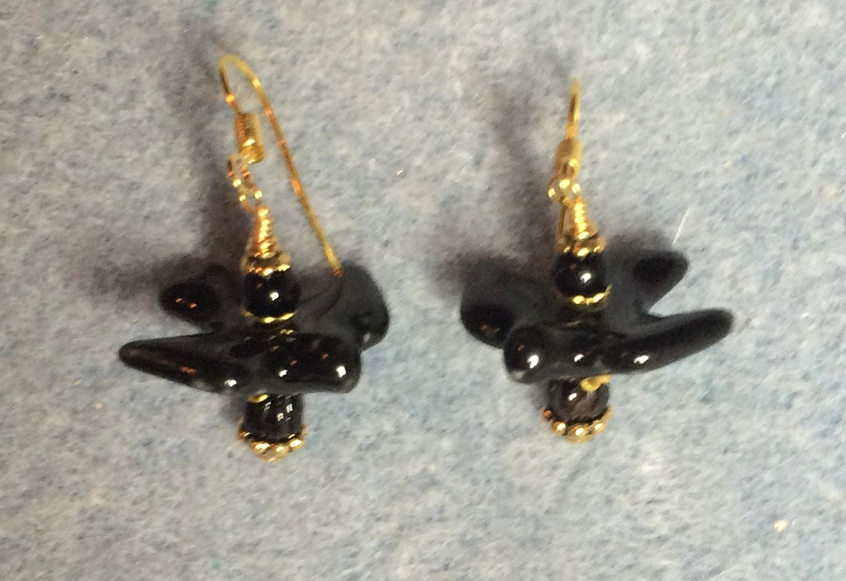 Black ceramic flying bird bead earrings adorned with black Czech glass beads.