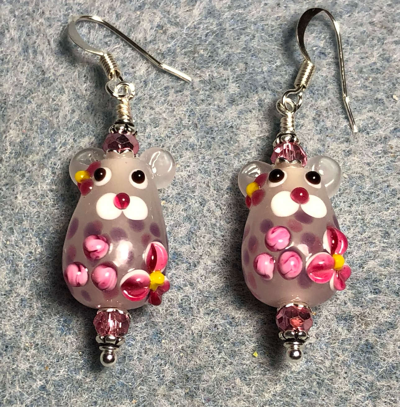 Light pink and hot pink lamp work mouse bead earrings adorned with hot pink Chinese crystal beads.