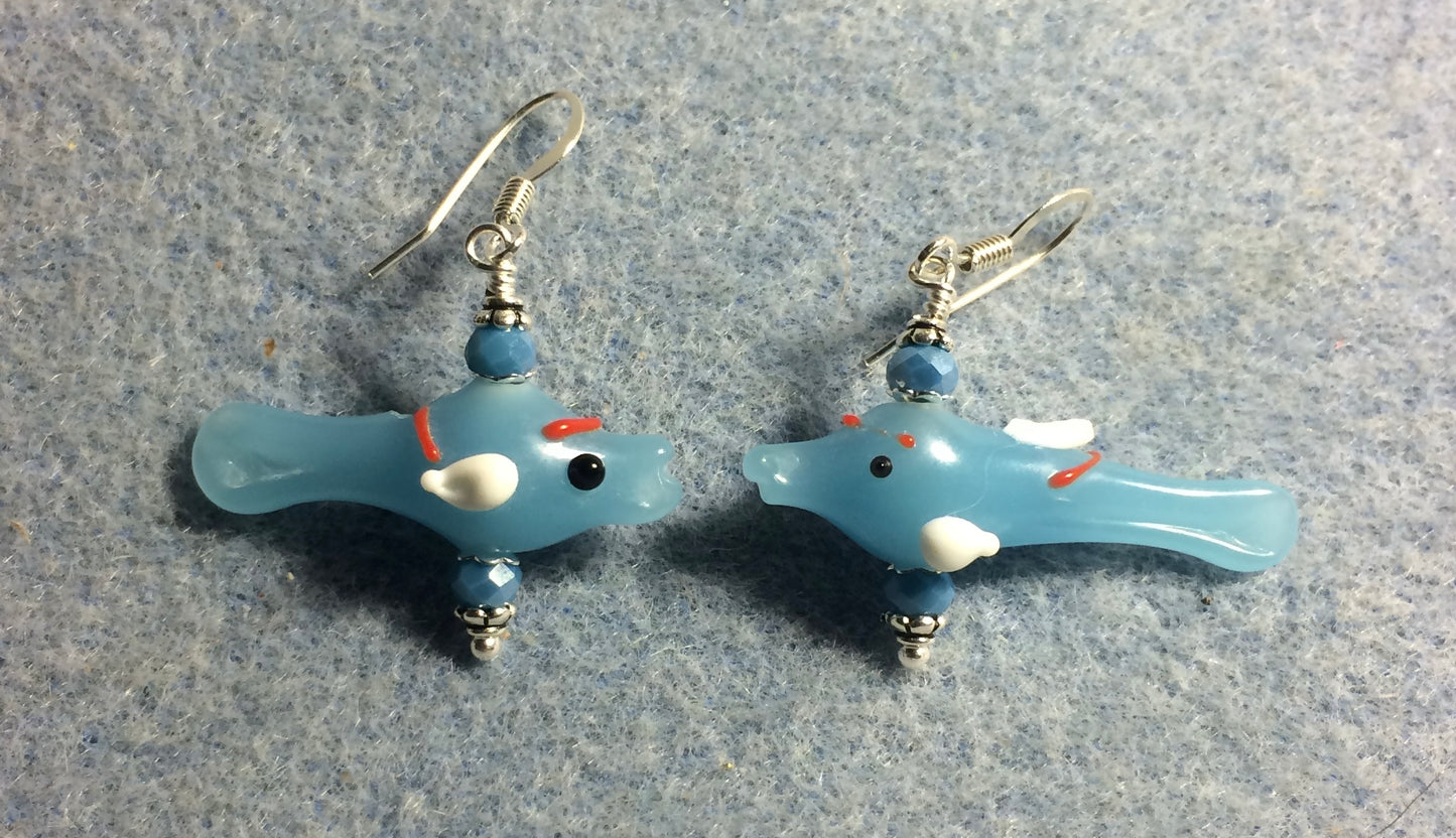 Small light blue and white lamp work fish bead earrings adorned with light blue Chinese crystal beads.
