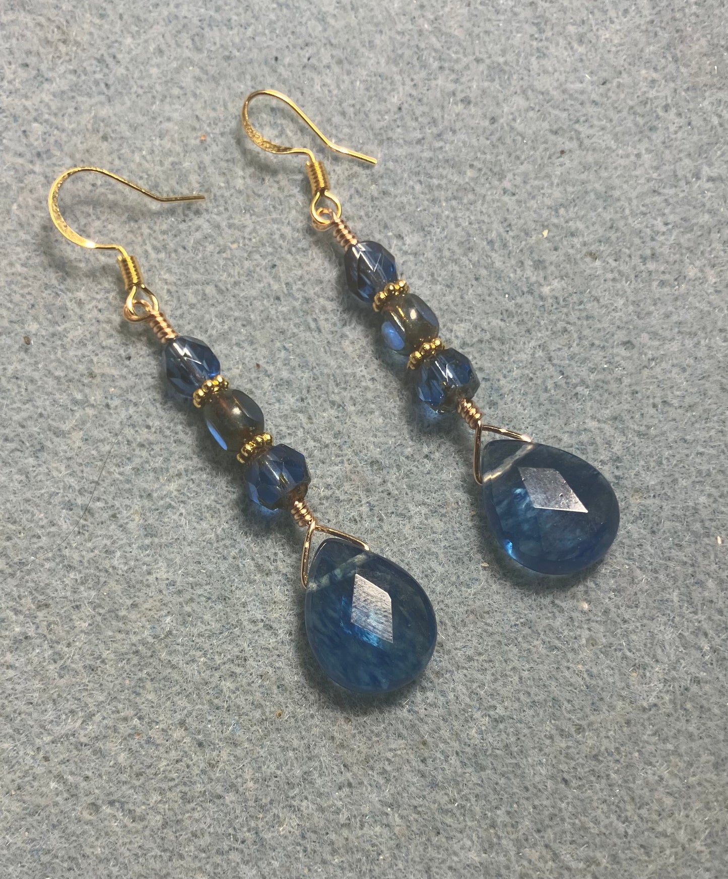 Blue mottled Czech glass briolette bead earrings adorned with blue Czech glass beads.