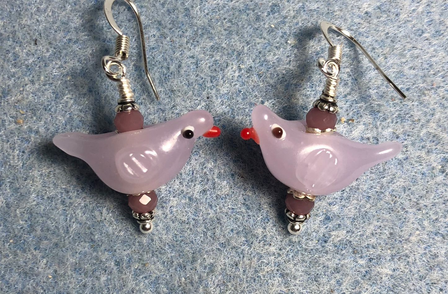 Milky violet lamp work songbird bead earrings adorned with violet Chinese crystal beads.