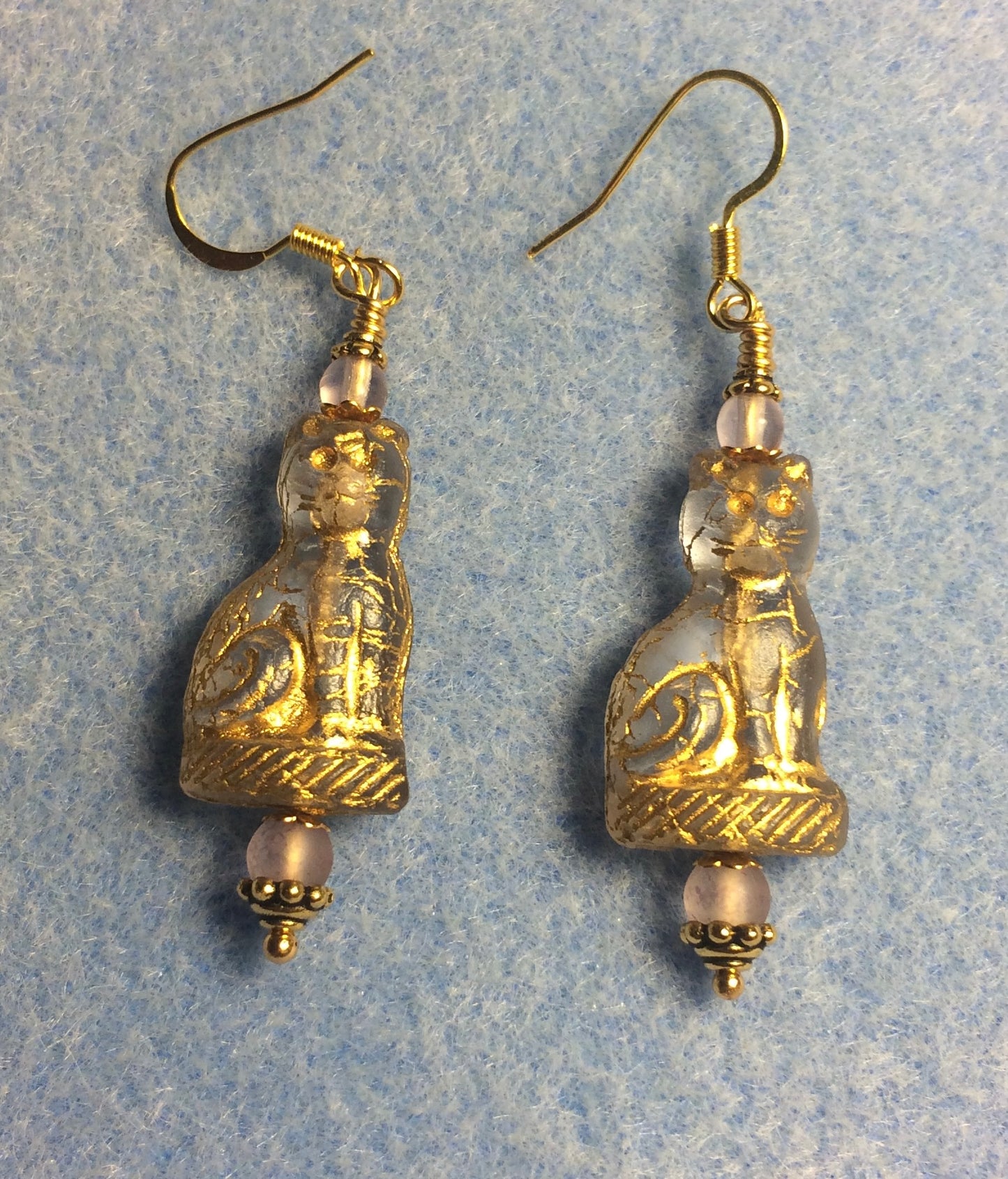 Translucent violet (with gold inlay) fancy Czech glass fancy cat bead earrings adorned with light violet Czech glass beads.