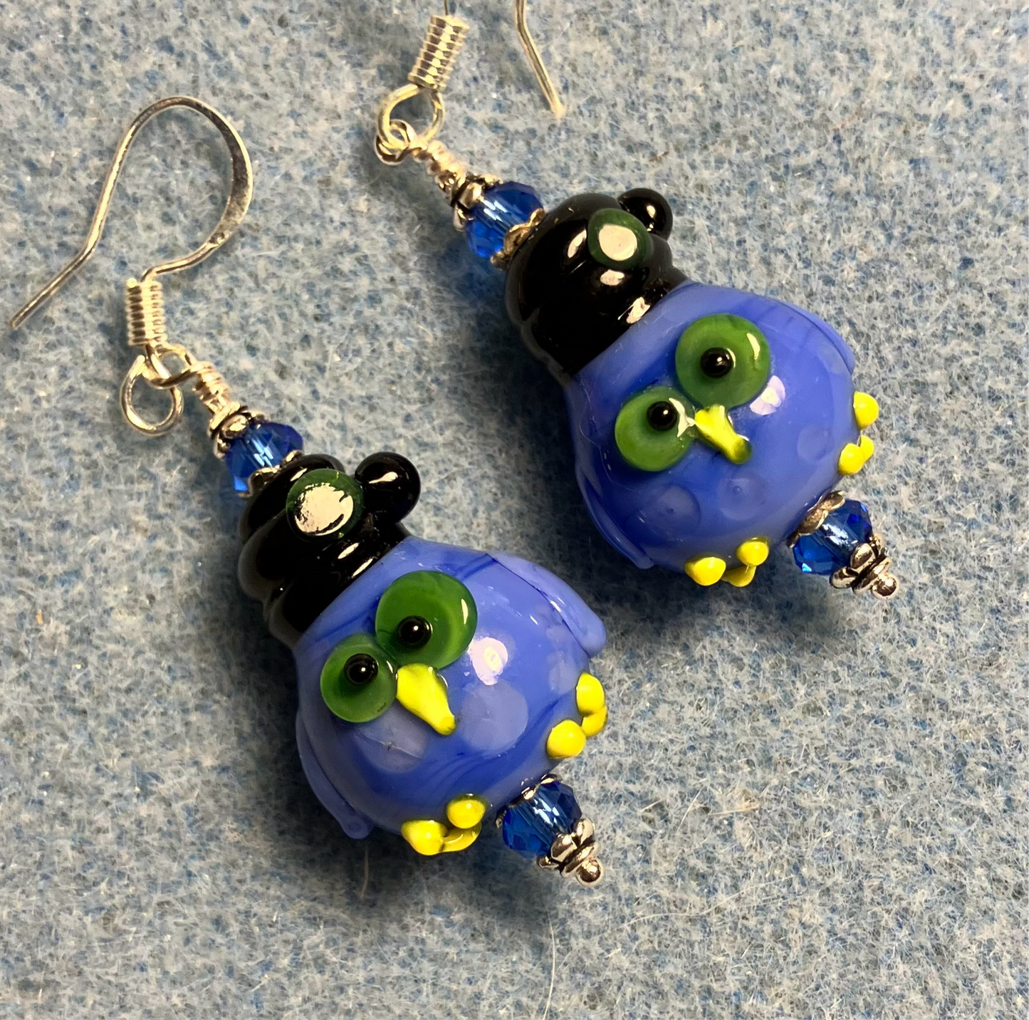Blue Halloween lamp work owl bead earrings adorned with blue Chinese crystal beads.