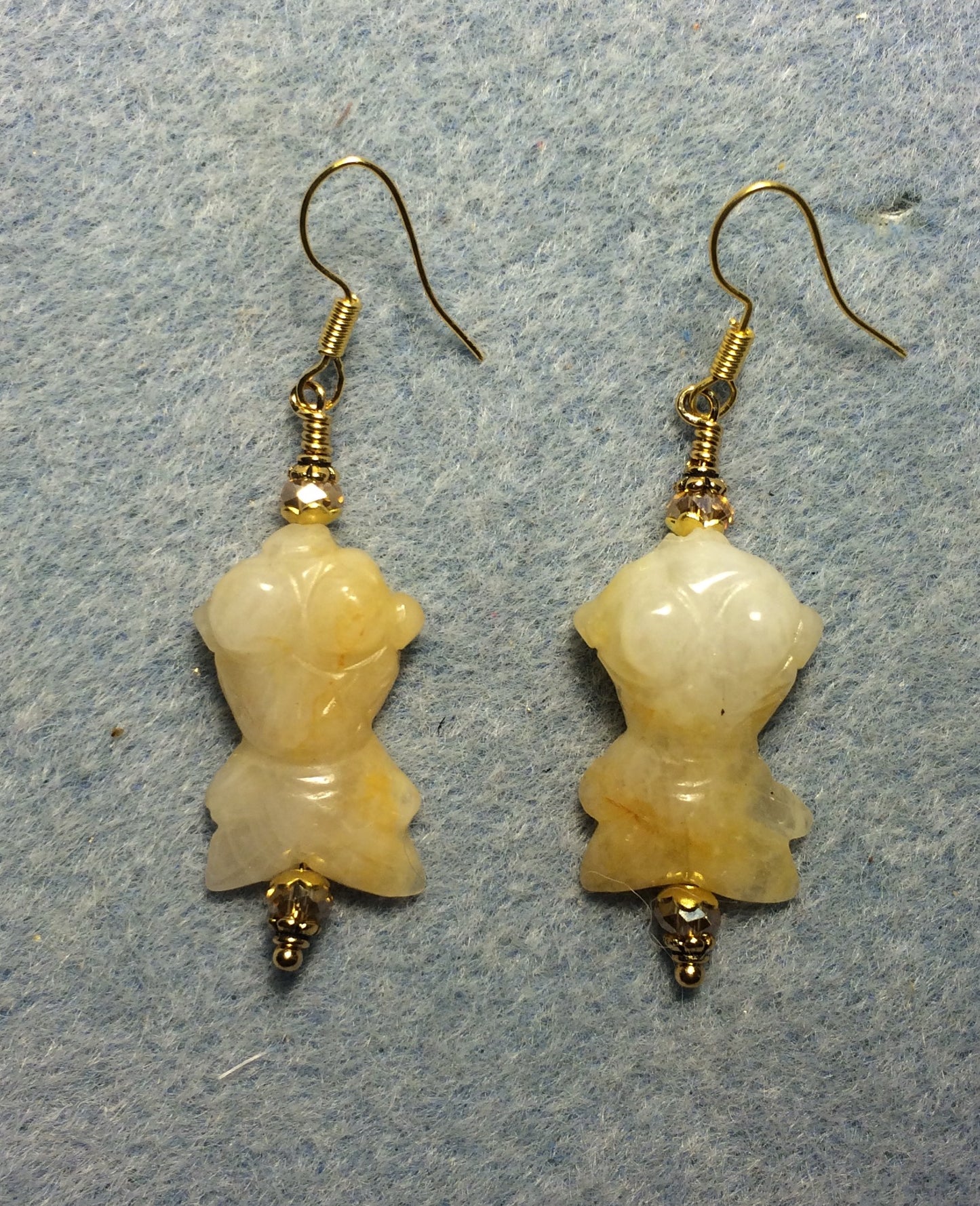 Yellow jadeite gemstone goldfish bead earrings adorned with topaz Chinese crystal beads.