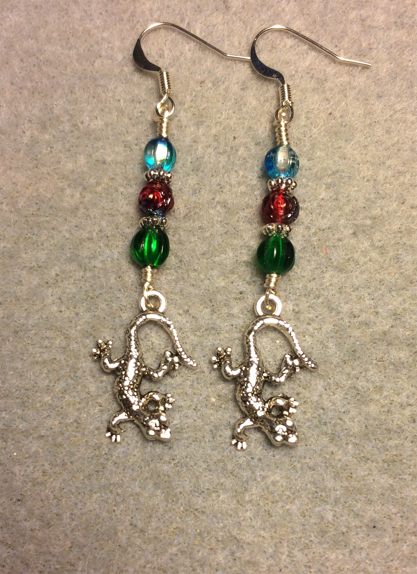 Small silver lizard charm earrings adorned with black Czech glass beads
