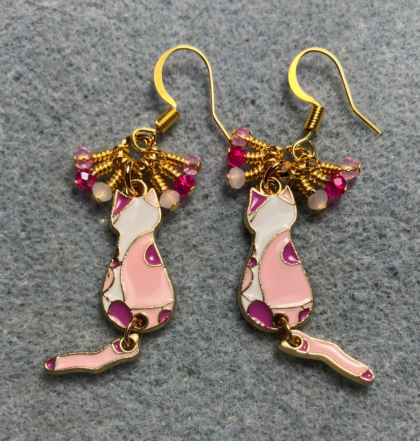Hot pink, light pink, and white enamel cat charm earrings adorned with tiny dangling hot pink, light pink, and white Chinese crystal beads.