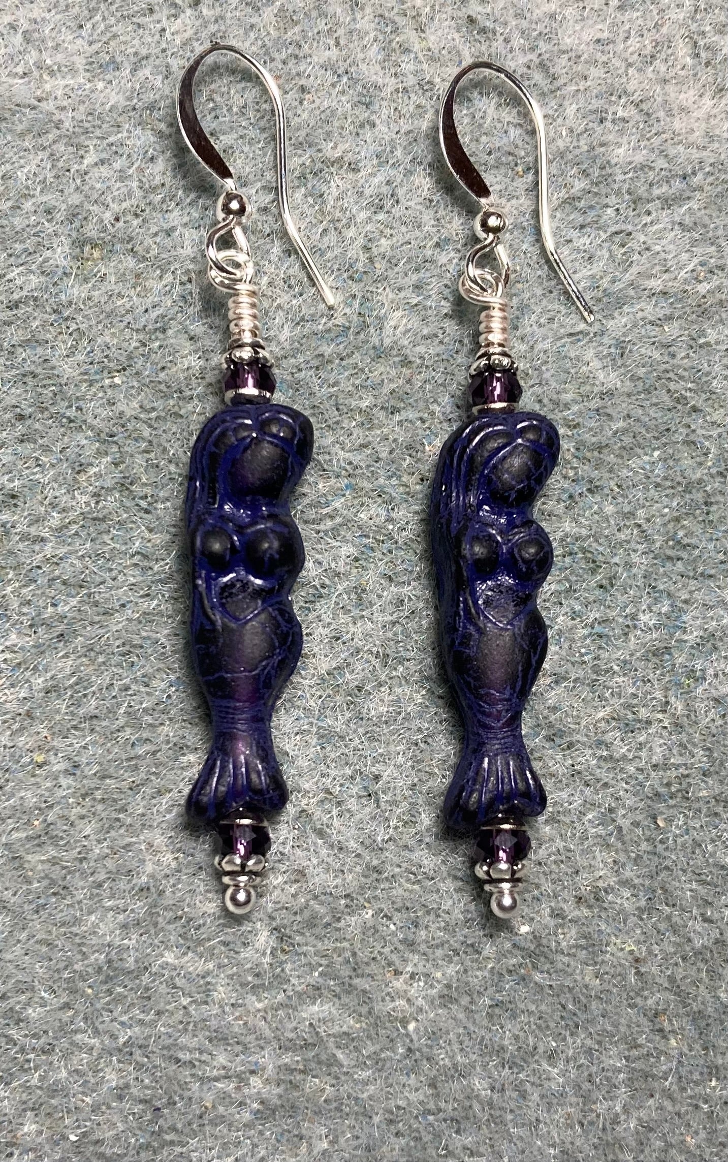 Dark purple Czech glass mermaid bead earrings adorned with purple Chinese crystal beads.