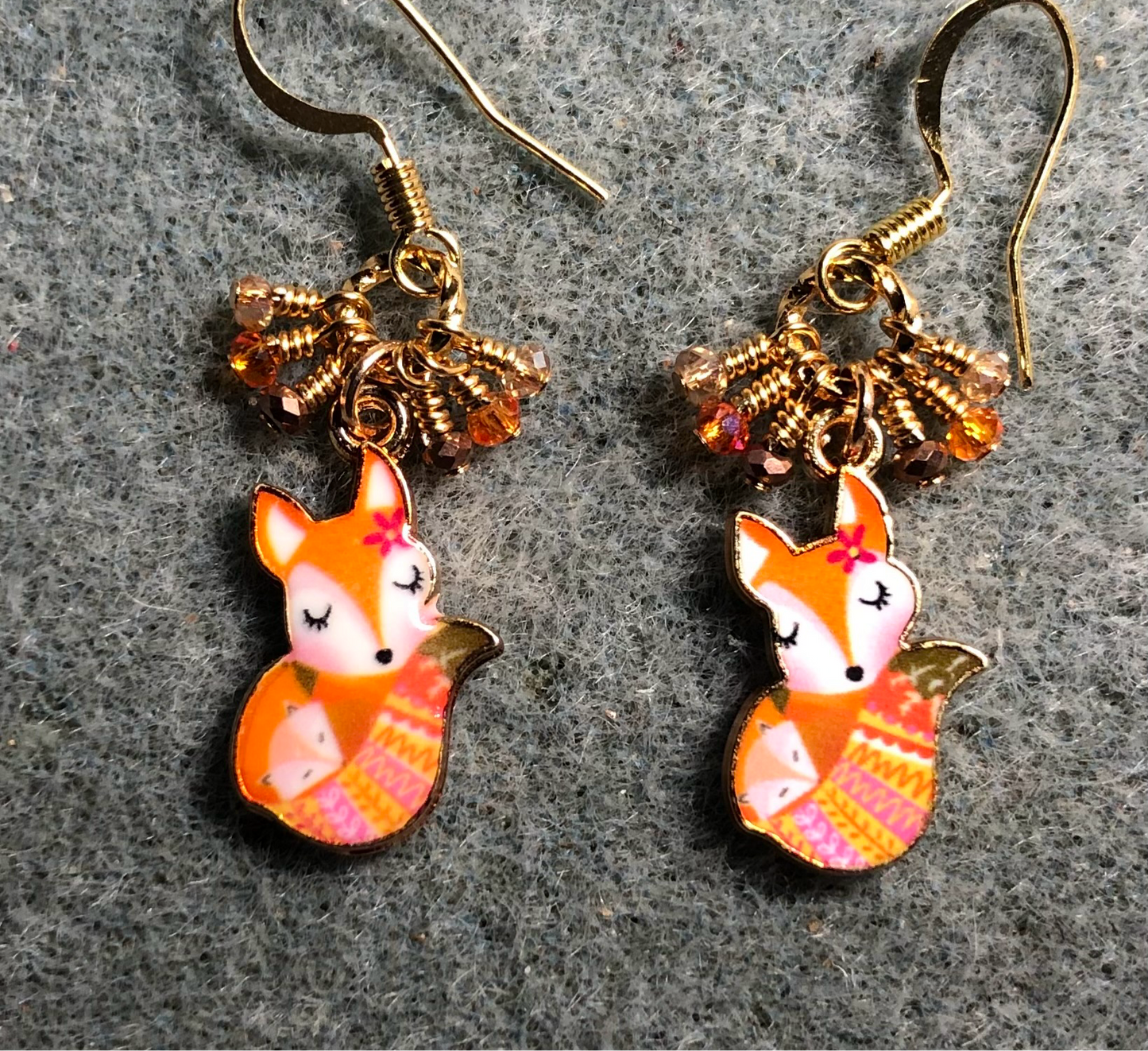 Small orange and tan enamel fox charm earrings adorned with tiny dangling orange, brown, and tan Chinese crystal beads.