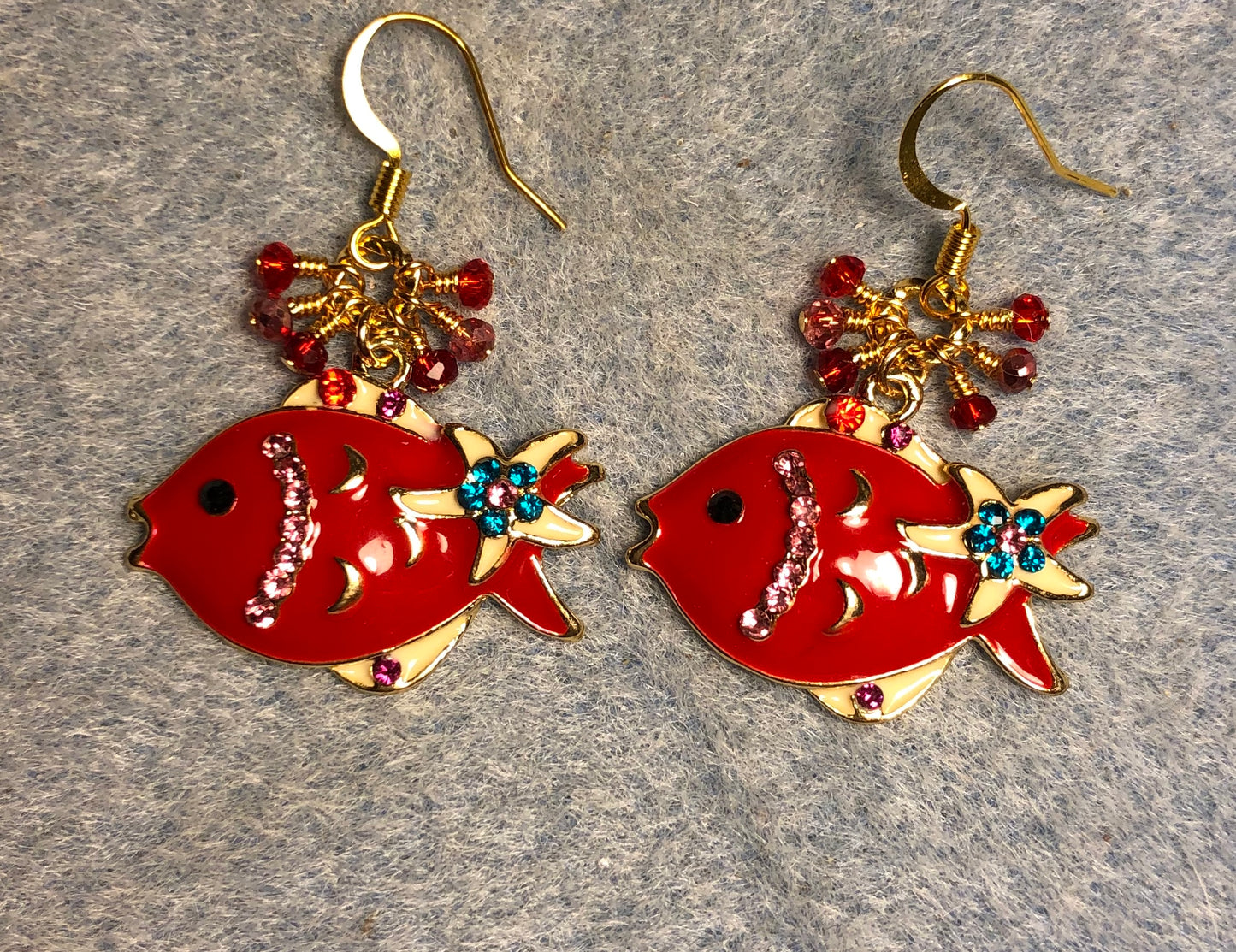 Red enamel and rhinestone fish charm earrings adorned with tiny dangling red and pink Chinese crystal beads.