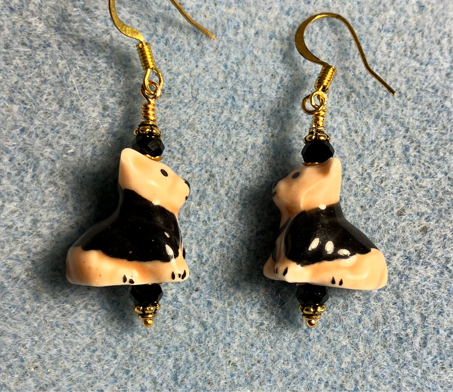 Tan and black ceramic puppy dog bead earrings adorned with black Chinese crystal beads.