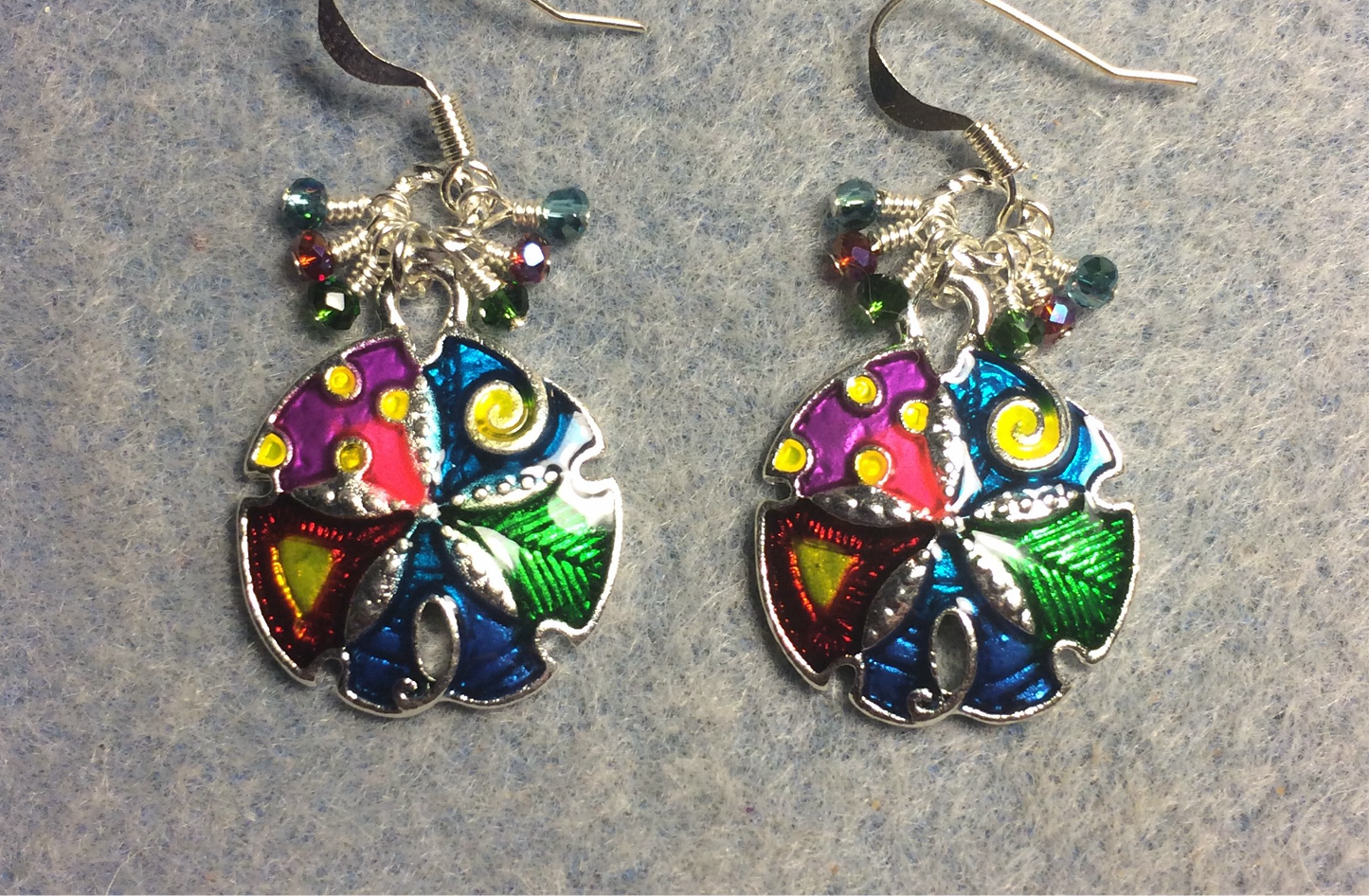 Colorful enamel sand dollar charm earrings adorned with tiny dangling green, red, and turquoise Chinese crystal beads.