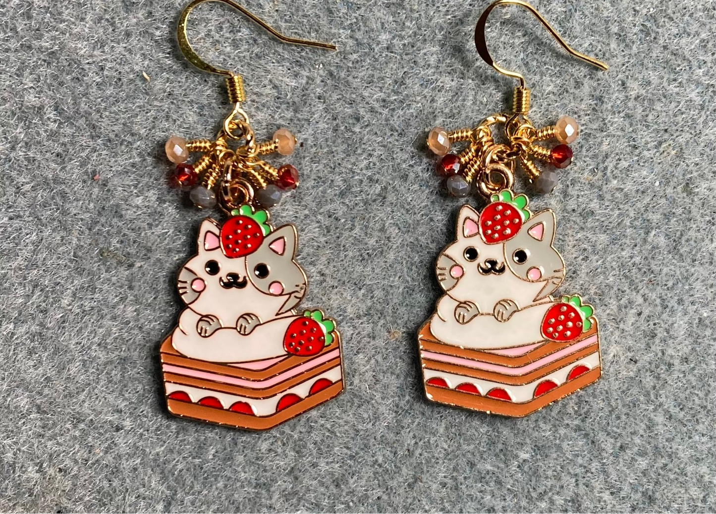 Red, white, and gray enamel cat charm earrings adorned with tiny dangling red, white, and gray Chinese crystal beads.