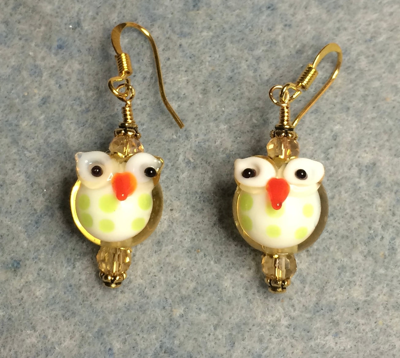 Small amber and green lamp work owl bead earrings adorned with amber Chinese crystal beads.