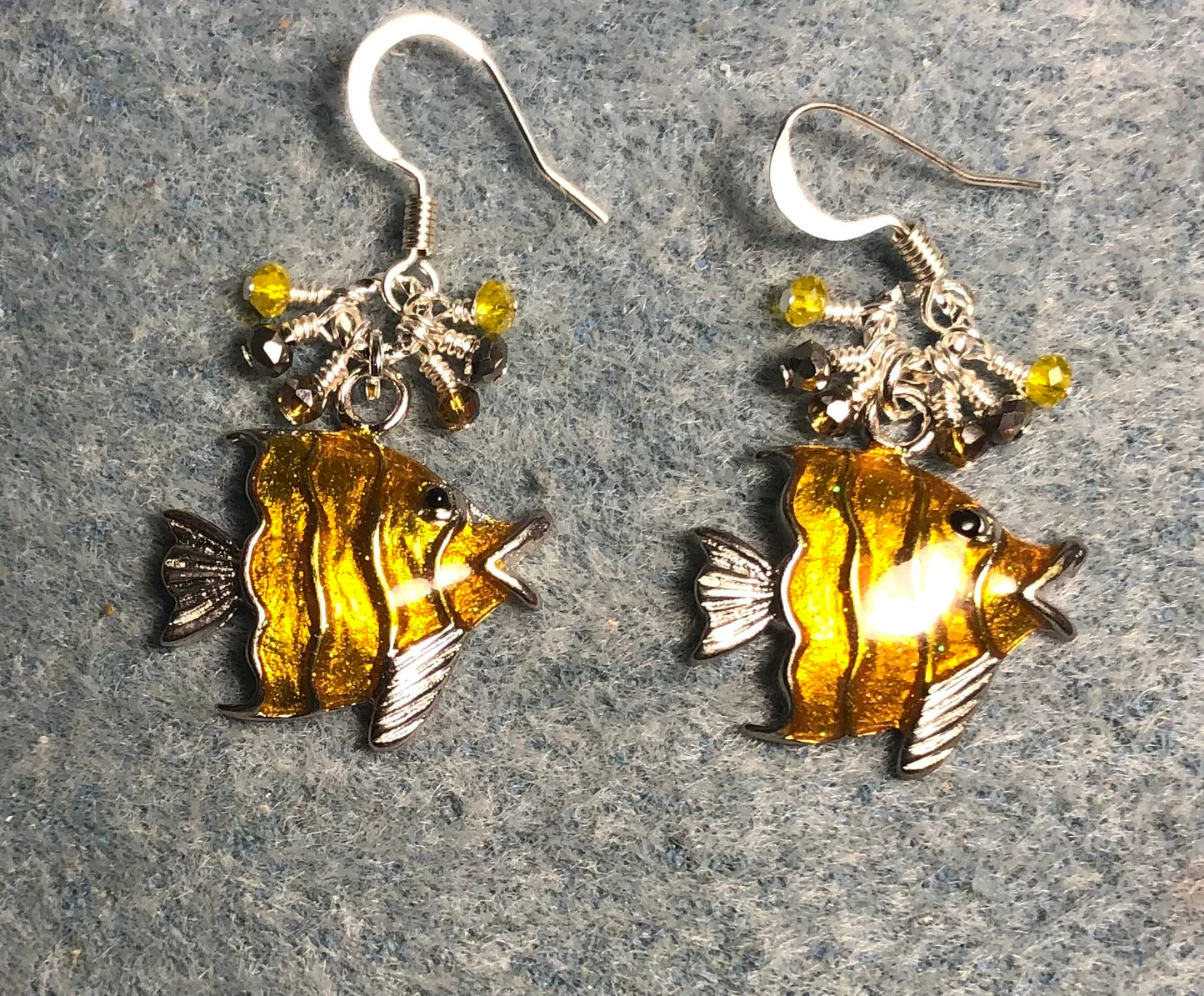 Silver and amber enamel angelfish charm earrings adorned with tiny dangling yellow, silver, and amber Chinese crystal beads.