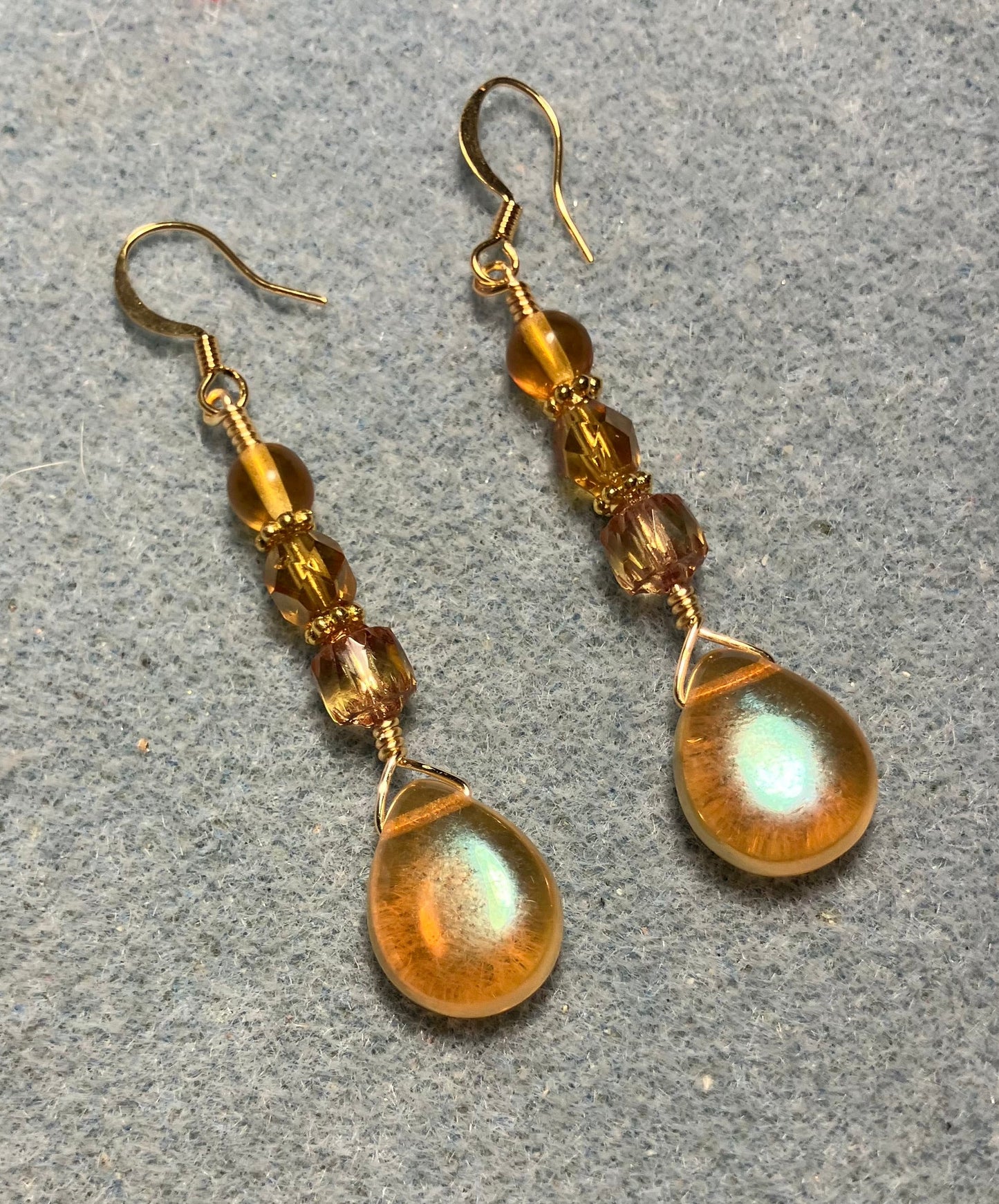 Amber Czech glass pear drop bead earrings adorned with amber Czech glass beads.